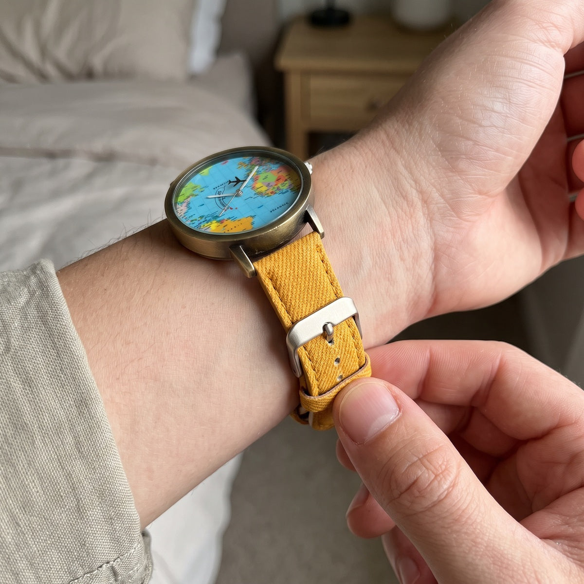 Yellow Skybound watch showing the buckle and textured strap