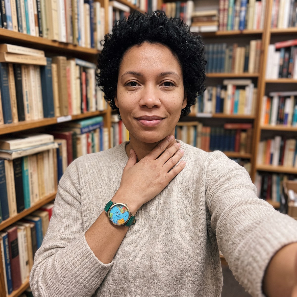 Woman in a bookshop wearing a Green Skybound watch