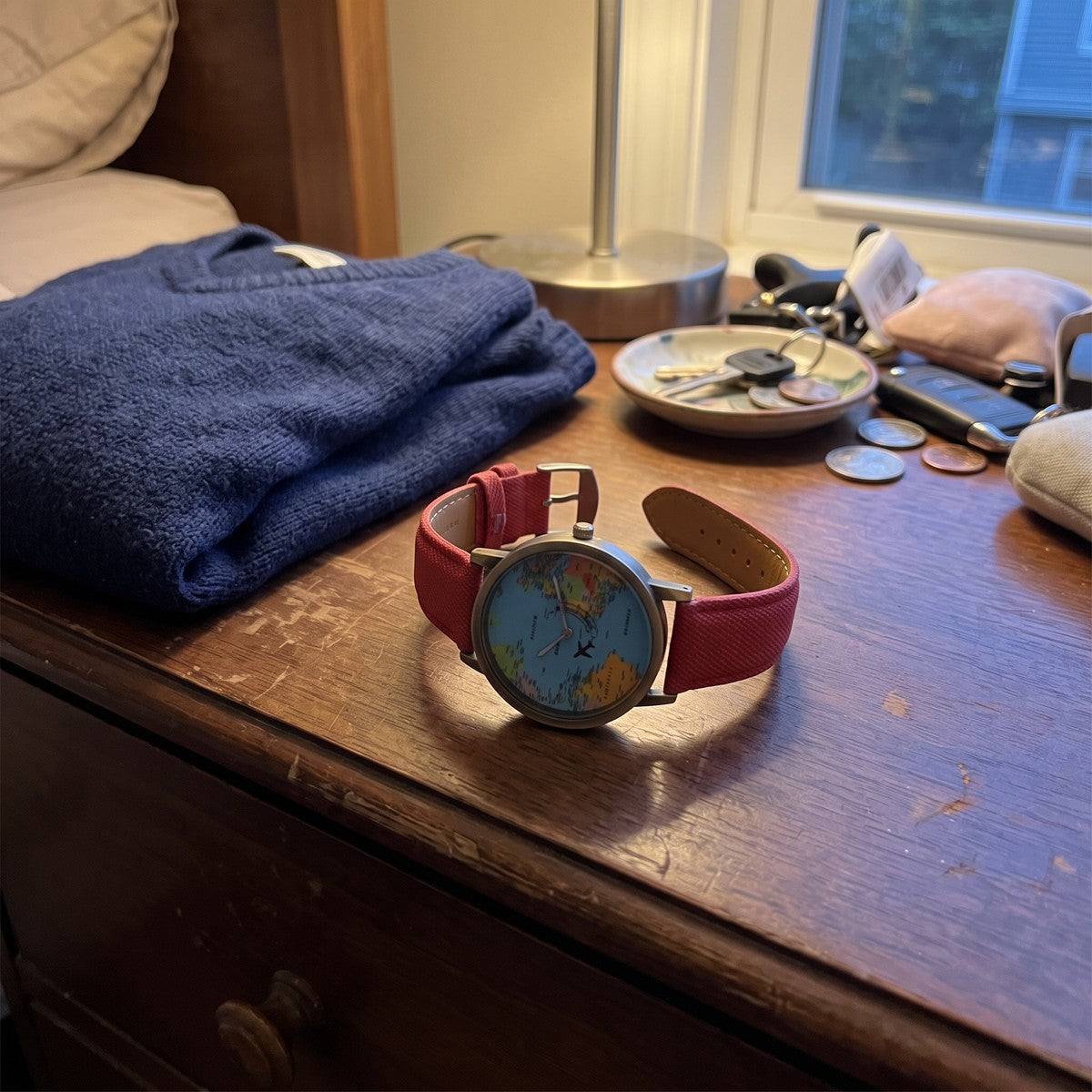 Red Skybound watch resting on a dresser after the day
